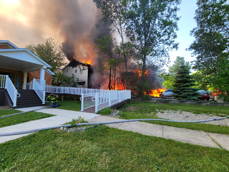 A catastrophic fire that destroyed two duplexes in Ann Arbor on Monday evening sprang up from a nearby fire pit where a resident was burning cardboard, fire officials said.