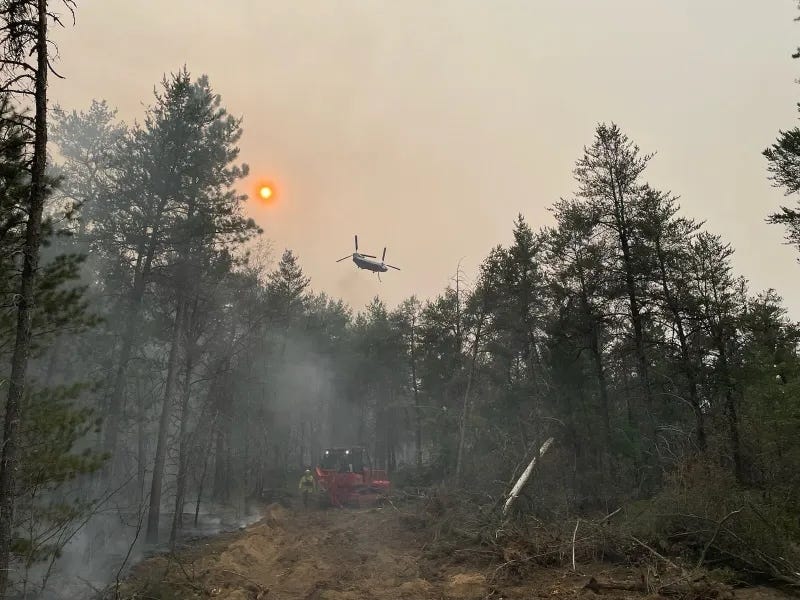 Fire crews battling a wildfire in Northern Michigan are also fighting against windy, dry conditions and warm weather that has allowed the blaze to burn nearly 230 acres.