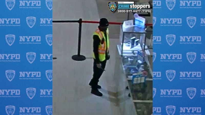 Video appears to show the suspect staring at jewelry in a case at the store