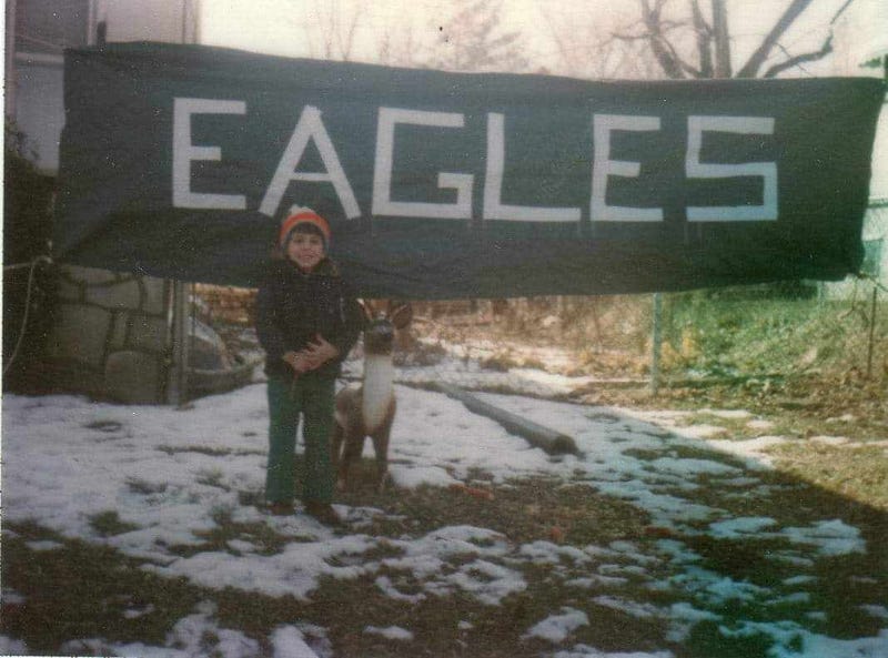 Young Tony Penecale with his family's Eagles banner.