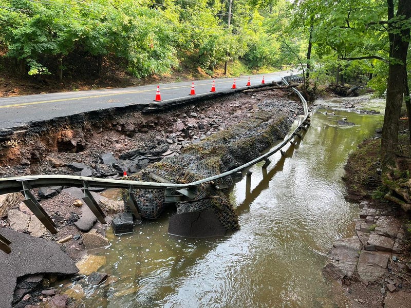 Road damage from flash flooding in Washington Crossing