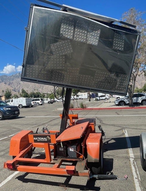 electronic sign leaning to one side