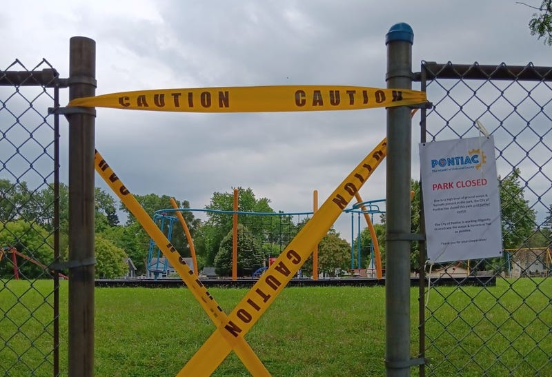 An Oakland County park remains closed for the third week as officials continue work on eliminating an infestation of wasps that have taken up residence on the grounds.