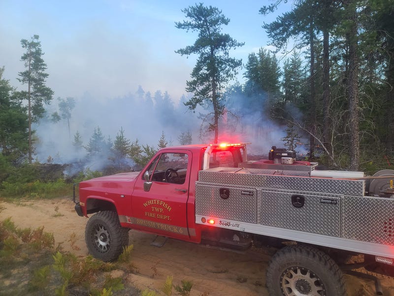 Officials are urging residents to steer clear as they work to contain and extinguish a wildfire that kindled in an eastern section of the Upper Peninsula.