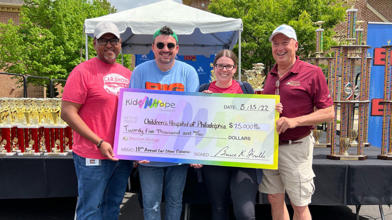 Coop with American Heritage Credit Union presenting the $25,000 check for the Kids-N-Hope foundation at BIG 98.1 and American Heritage's 18th Annual Car Show