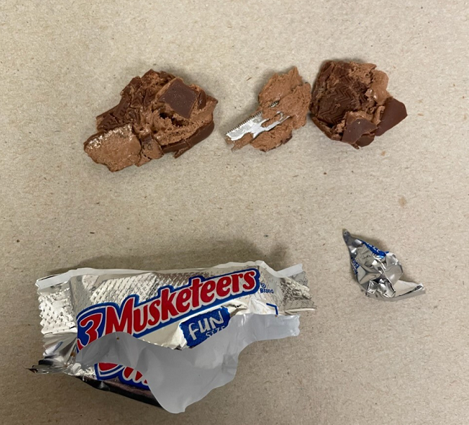 The blade was found in a mini 3 Musketeers bar in Setauket, police said
