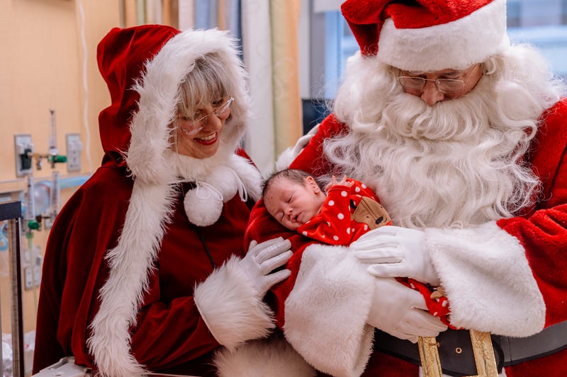 Babies with Santa and Mrs. Claus