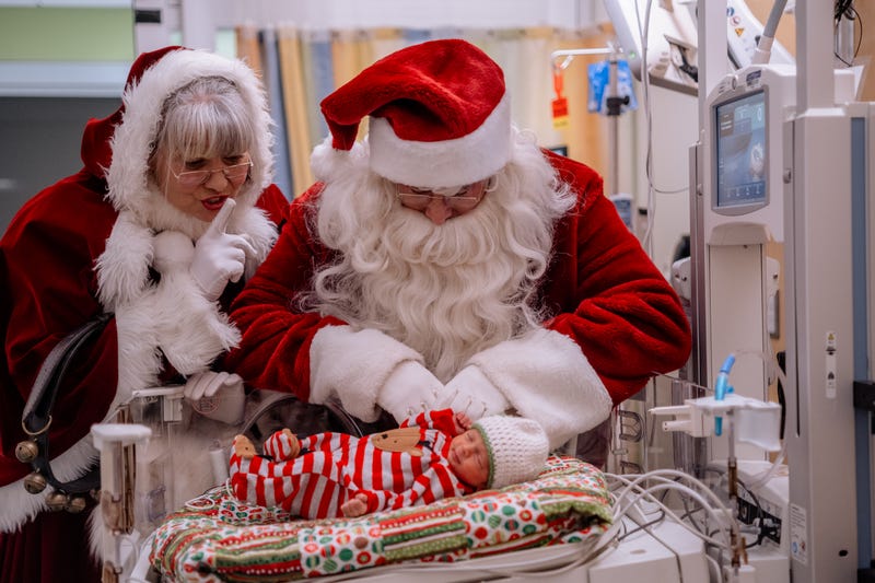 Baby with Santa and Mr.s Claus