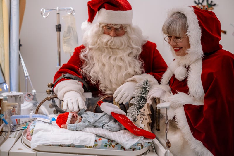 Santa, Ms. Claus with tiny baby