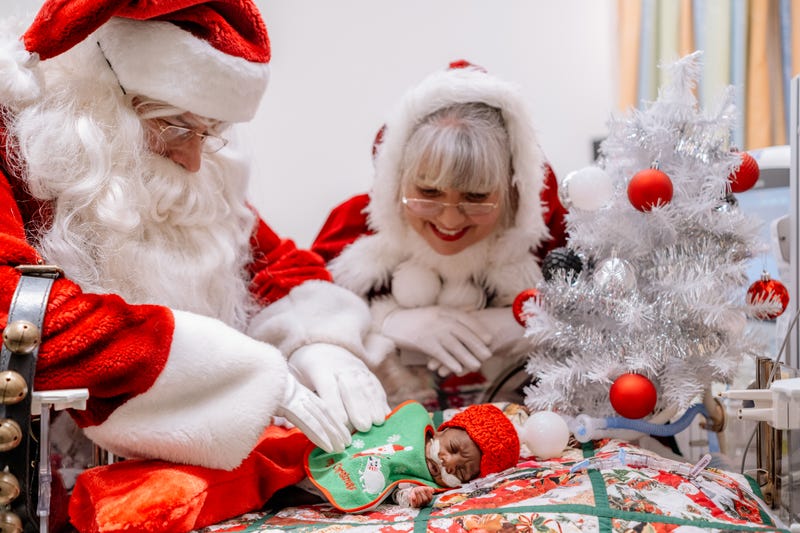 Santa, Ms. Claus with tiny baby