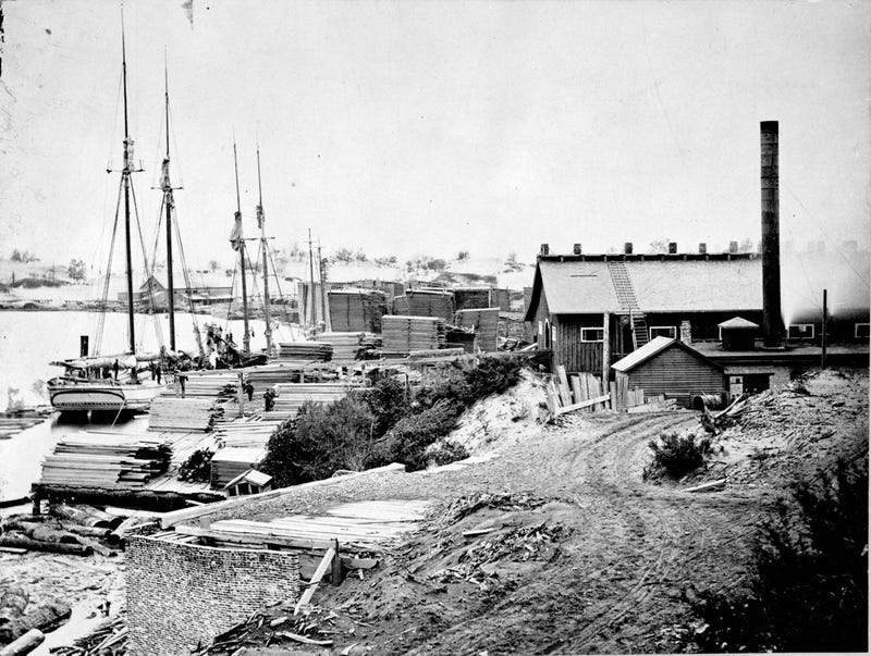 The saw mill and lumber yard in Singapore at the mouth of the Kalamazoo River, circa 1869.