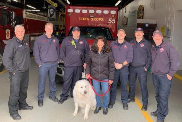 Firefighters with Roseanne and Belle, the Great Pyrenee