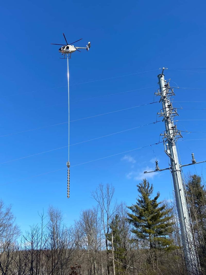 A giant buzz saw dangling from helicopter to make its way across Southwest Michigan