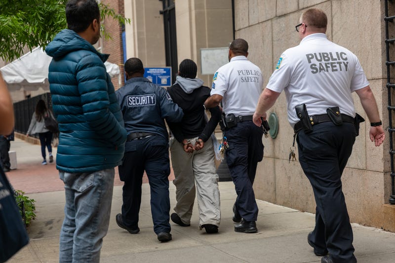 A person is detained outside of Columbia University's Butler Library after pro-Palestinian protesters occupied the space on May 7