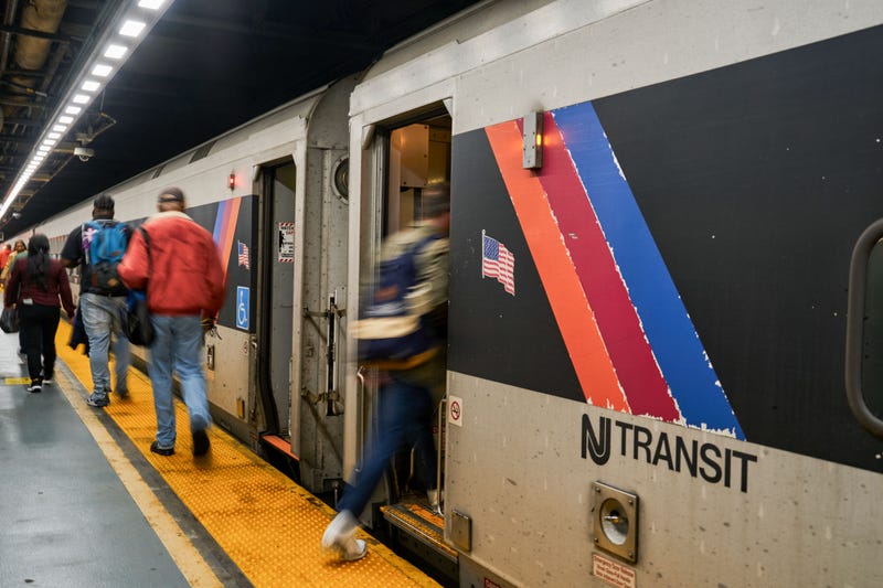 Commuters board a New Jersey Transit train at Penn Station in New York on May 5