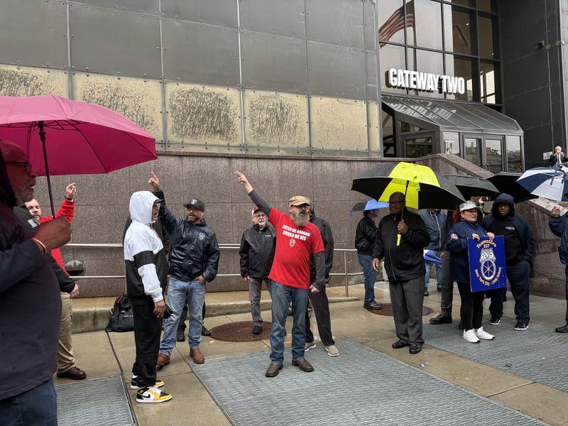 Union members demonstrate outside of NJ Transit’s headquarters moments before a board meeting in Newark, New Jersey, on May 14