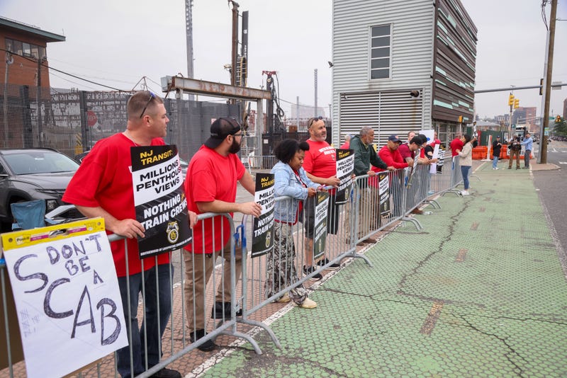 Workers picket outside of the Hoboken Terminal during a strike in Hoboken, New Jersey