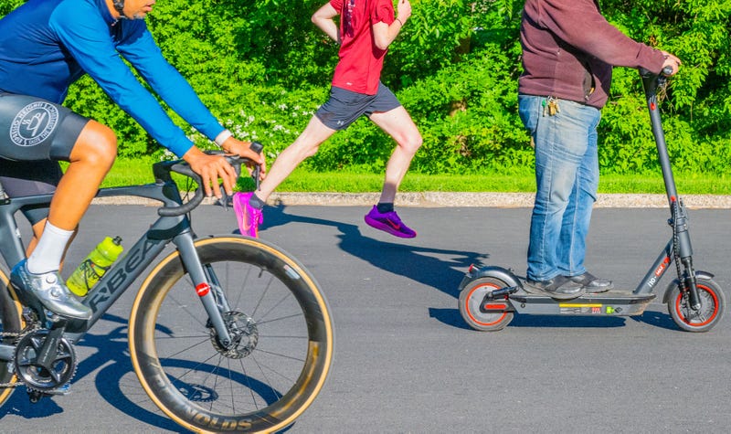 Runners, scooter-riders and cyclists navigate the 6.1-mile loop through the park. 
