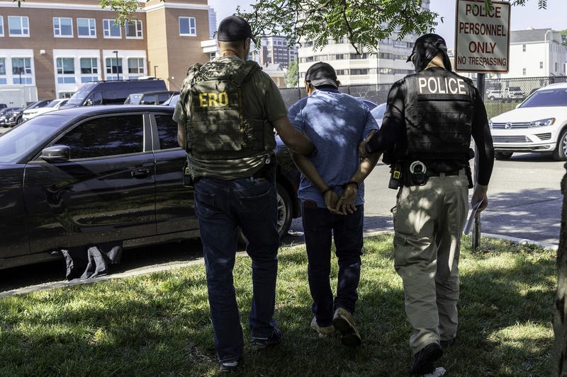 Agents from Immigration and Customs Enforcement detain an immigrant after a court hearing at the Connecticut Superior Court in Stamford, Connecticut, on July 3