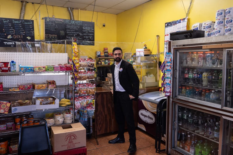 Mamdani while ordering an iced coffee from a deli after a campaign event in Queens in June