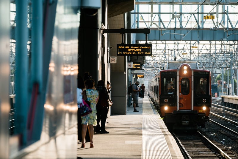 Commuters on a platform as a train arrives at the Metro-North station in Stamford, Connecticut.