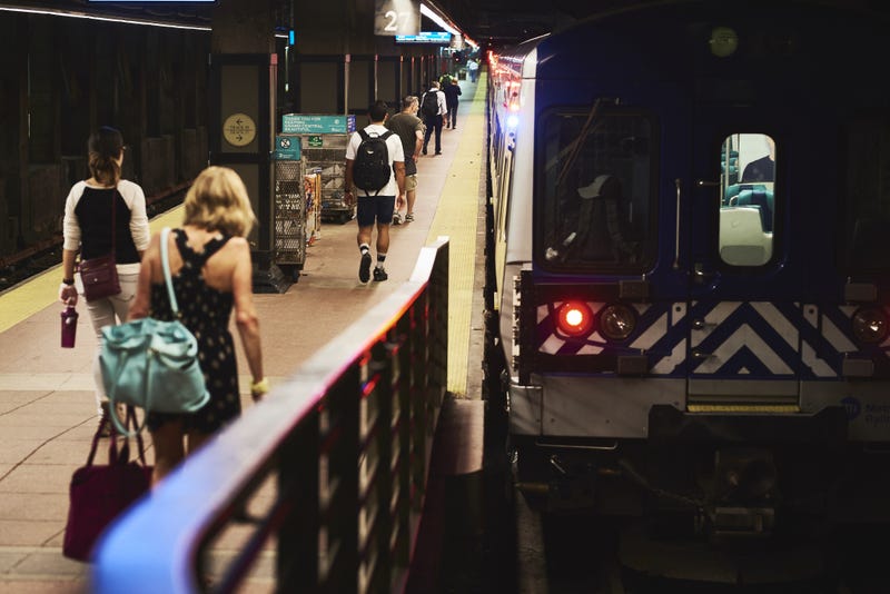 Commuters enter a Metro-North Railroad train at Grand Central Terminal