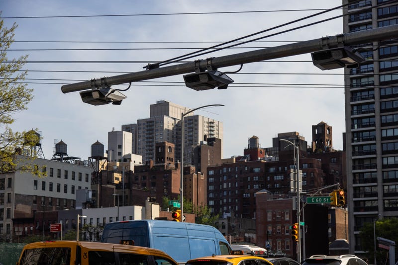 E-ZPass readers and license plate-scanning cameras over Second Avenue in New York.