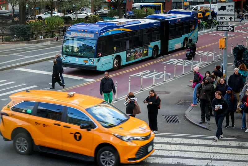 An MTA bus and a taxi in New York on Nov. 6.