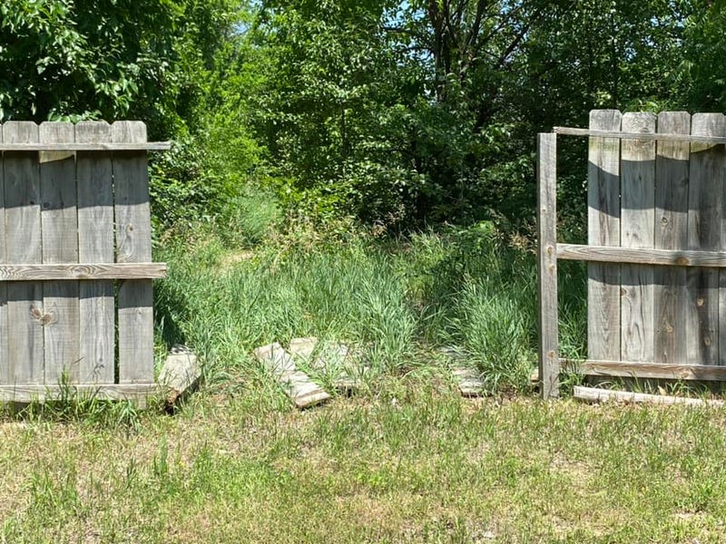 Break in fence created by stolen car.