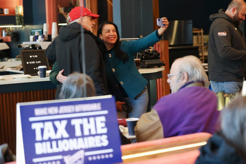 Analilia Mejia, US Democratic House candidate for New Jersey, center right, takes a photo at Paper Plane Coffee Co. in Montclair, New Jersey, on Jan. 29.