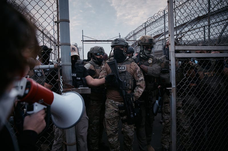 Federal agents stand guard during a protest against federal immigration enforcement raids at Delaney Hall Detention Facility in Newark in June 2025. Several Democratic candidates in the New Jersey House race are calling to abolish ICE, or threatening to defund it.