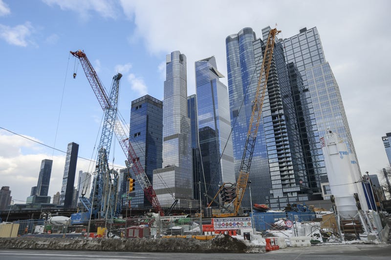 Commuters board a New Jersey Transit train at Penn Station in New York.