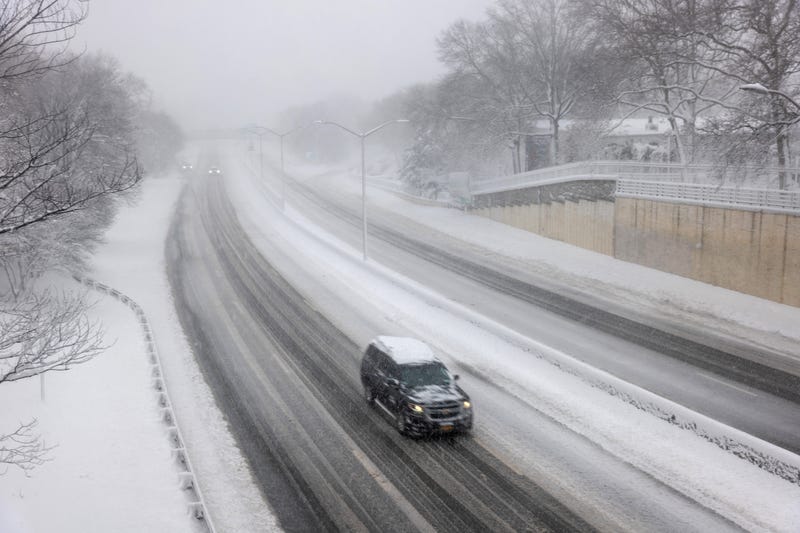 Few cars move along a Brooklyn highway as blizzard conditions continue in New York on Feb. 23