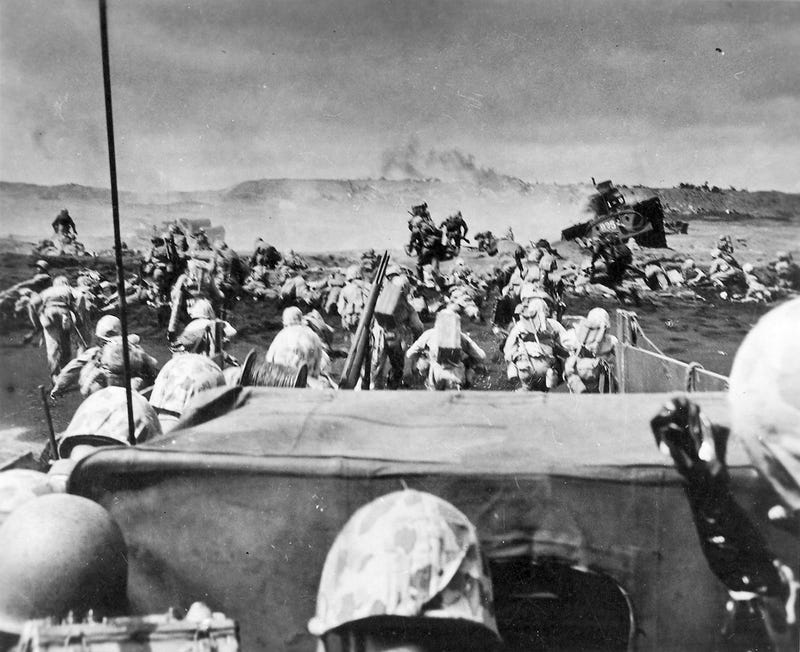 Marines stream ashore on Iwo Jima, Japan, Feb. 19, 1945.
