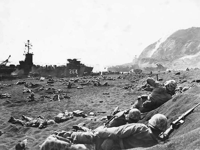Marines advance on Iwo Jima, Japan, Feb. 19, 1945.