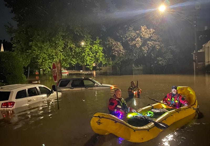 Rockford firefighters make their way through flooded streets. Storms hit the area Saturday night and remained through Sunday morning, and officials said the fire department responded to more than 120 calls related to the flooding.
