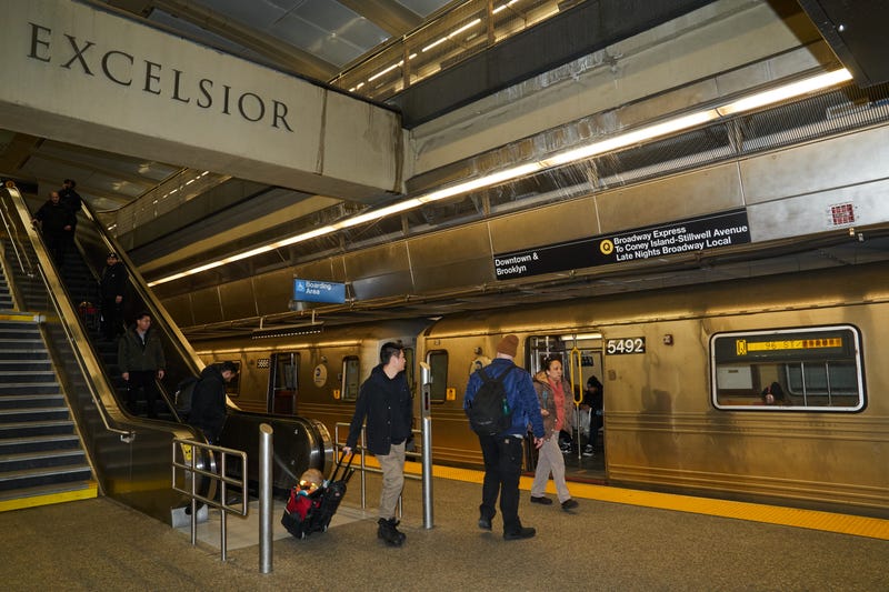 Commuters board a southbound Q train at the 96th Street-Second Avenue subway station in New York.