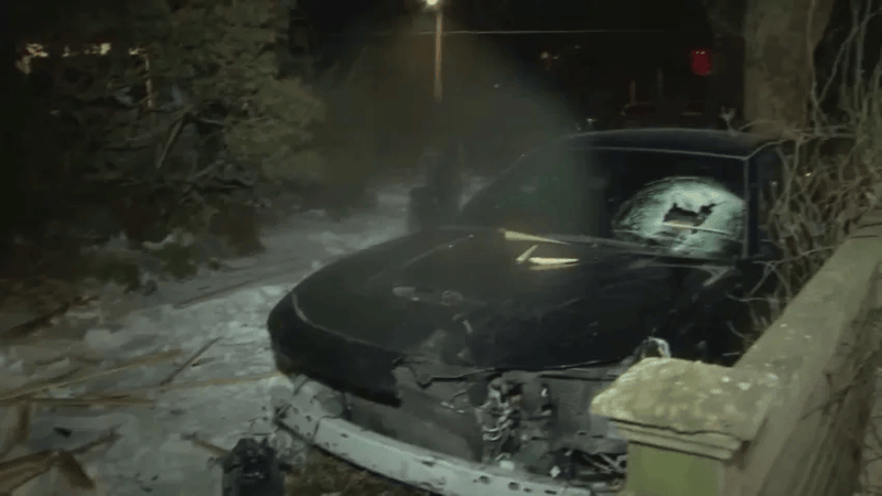 Footage of the car coming to a rest in the front yard of a house on Pelham Road in West Mount Airy early Sunday morning.