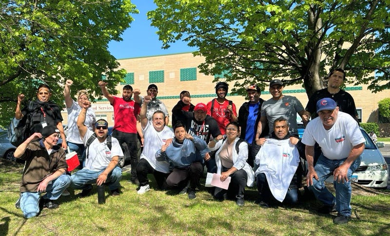 Portillo's workers in Aurora pose for a photo after voting to form a union.