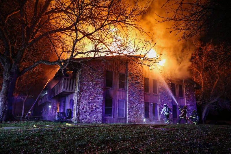 Firefighters battle a fire in Woodstock