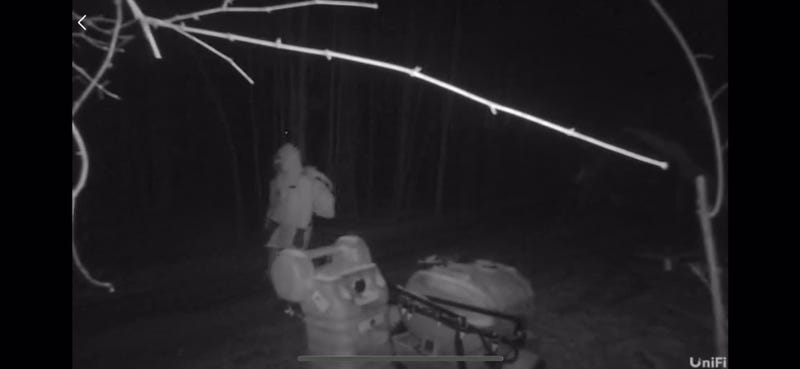 Man in white on security camera