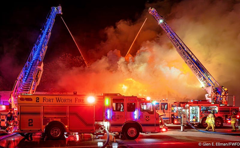 Crews battle fire in the 700 block of North Main Street in Fort Worth, Texas on Monday, Dec. 30, 2024.
