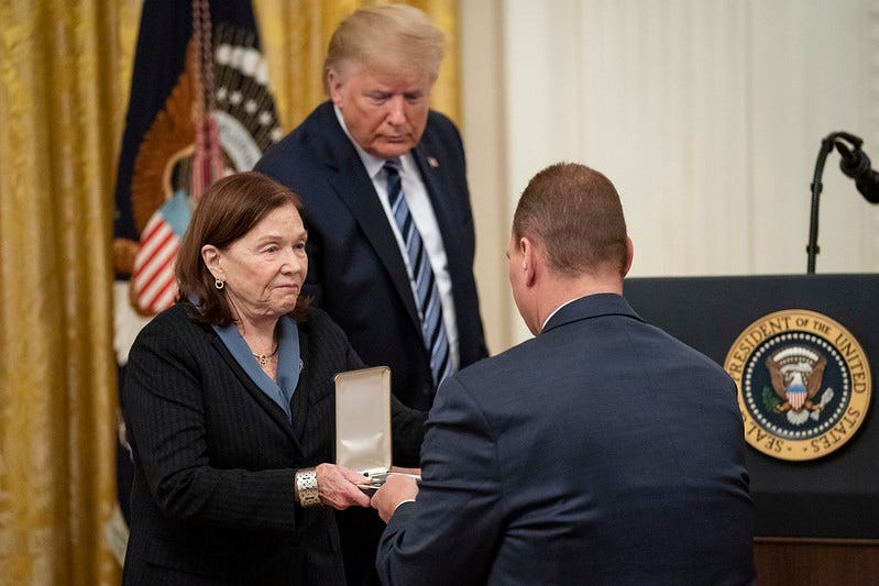 President Donald J. Trump looks on as Susan Rescorla shows the Presidential Citizens Medal, posthumously awarded to her husband Richard “Rick” C. Rescorla, to her son Trevor Thursday, Nov. 7, 2019.