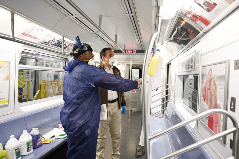 Cuomo disinfects a 7 train car in Queens