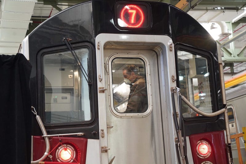 Cuomo disinfects a 7 train car in Queens