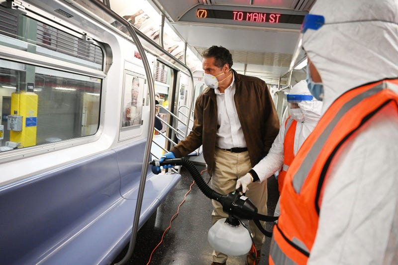 Cuomo disinfects a 7 train car in Queens
