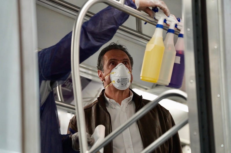 Cuomo disinfects a 7 train car in Queens