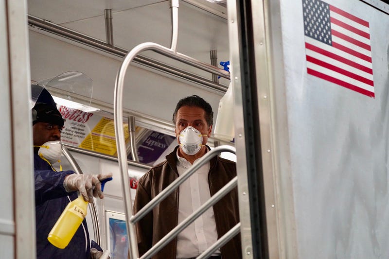 Cuomo disinfects a 7 train car in Queens