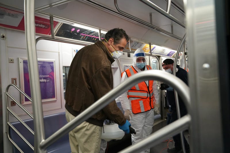 Cuomo disinfects a 7 train car in Queens