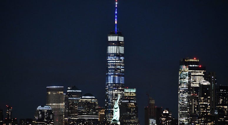 One World Trade Center lit in blue and gold